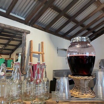 Blue Door Winery - a large pitcher of wine on a bar - Wineries Near Me - Julian, California Blue Door Winery - a large pitcher of wine on a bar - Wineries Near Me - Julian, California