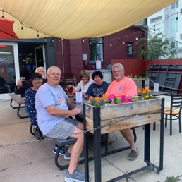 a group of people sitting at a table a group of people sitting at a table