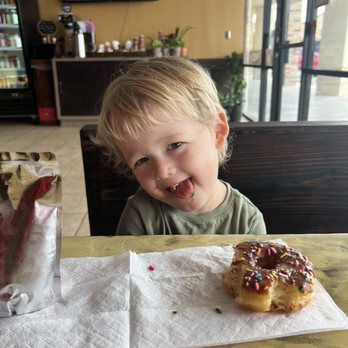 Crown Donuts - Baby eating Choco Sprinkle Donut - Donuts Near Me - Austin, Texas