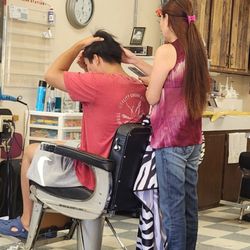 A Cut Above Hair Salon - Drafting a haircut. Anh was friendly helped suggesting a haircut.