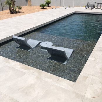 Custom Pool Care - Remodel with 10" depth seating lagoon and new dark pebble surface. - Pool & Hot Tub Service Near Me Custom Pool Care - Remodel with 10" depth seating lagoon and new dark pebble surface. - Pool & Hot Tub Service Near Me