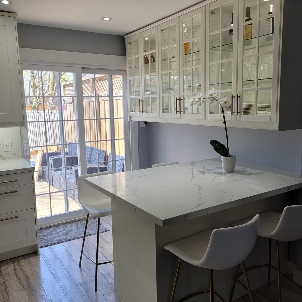 Kaspro Home - a kitchen with a large island - General Contractors Near Me