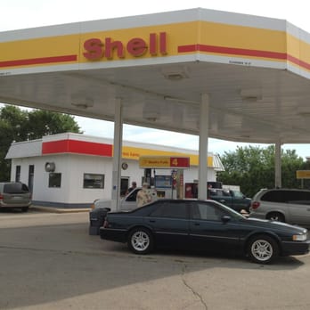 Shell Expresslane - a black car parked in front of a shell station - Convenience Stores Near Me - Freeport, Illinois