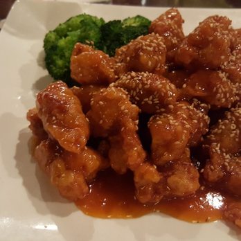 Red Sun Chinese Cuisine - Sesame chicken with broccoli garnish - Chinese Near Me - Rochester, New York Red Sun Chinese Cuisine - Sesame chicken with broccoli garnish - Chinese Near Me - Rochester, New York