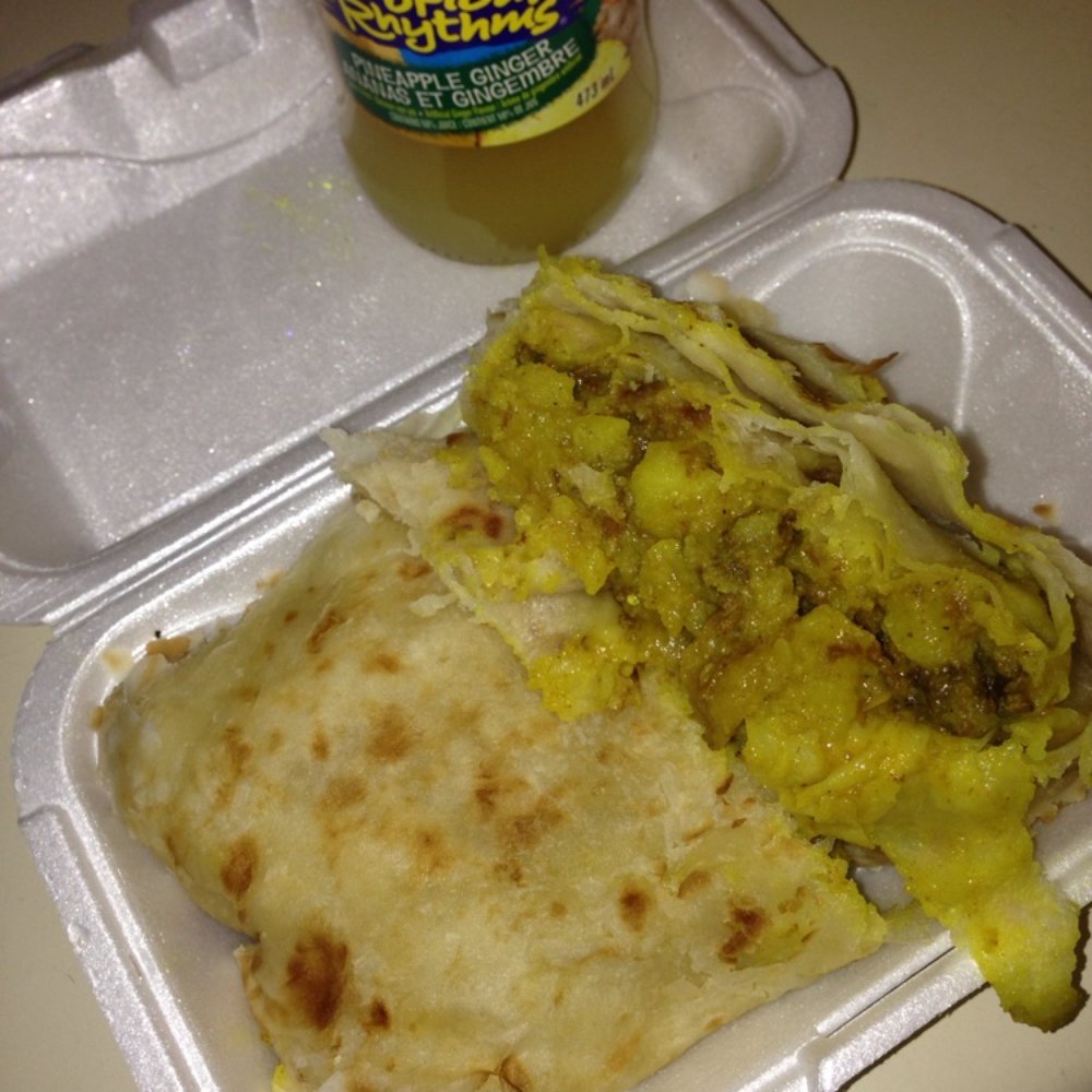 Rose's Caribbean Kitchen - Goat roti and pineapple ginger juice! - Caribbean Near Me - Brampton, Ontario