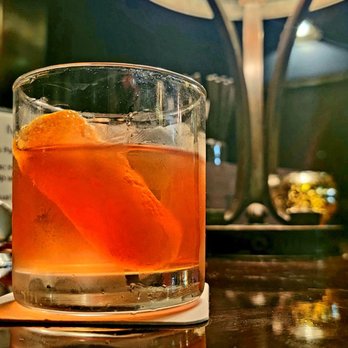 Buhl Bar - a drink in a glass with an orange garnish - Cocktail Bars Near Me - Detroit, Michigan