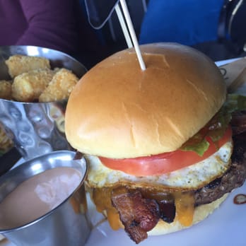 Topgolf - Sunrise burger. Applewood bacon, cheddar cheese, and a fried egg. - Golf Near Me - Houston, Texas Topgolf - Sunrise burger. Applewood bacon, cheddar cheese, and a fried egg. - Golf Near Me - Houston, Texas