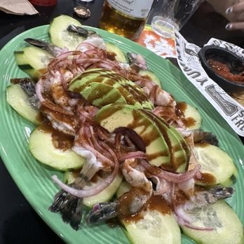 La Caguama - a green plate with sliced cucumbers and onions - Mexican Near Me - Yucca Valley, California La Caguama - a green plate with sliced cucumbers and onions - Mexican Near Me - Yucca Valley, California