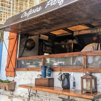 Crepes Parfait - Outside of the food truck. There you can hear the music playing, it may be French? - Creperies Near Me