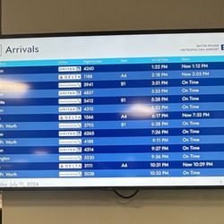 Avis Rent A Car - This airport board shows the time. I've been here over three hours. It's now after 1 PM.
