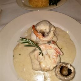 Flounder stuffed with shrimp in a white wine champagne sauce Flounder stuffed with shrimp in a white wine champagne sauce