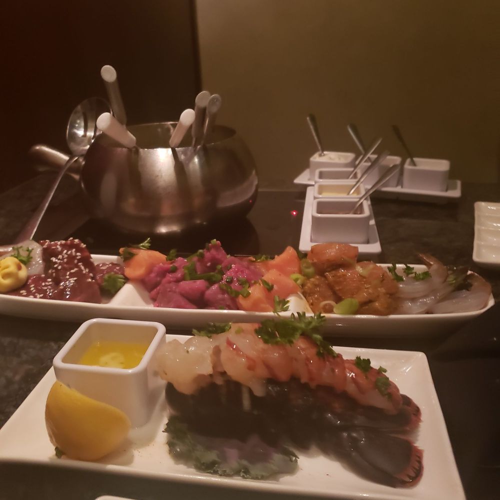The Melting Pot - Spread of meats and lobster - Fondue Near Me - Orlando, Florida The Melting Pot - Spread of meats and lobster - Fondue Near Me - Orlando, Florida