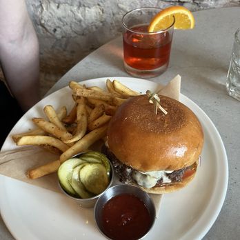 Georgie's - Burger with added aged cheddar cheese - Bars Near Me - Georgetown, Texas