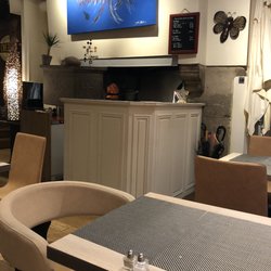 Chez Kub - The fireplace behind the desk was actually in use for cooking!