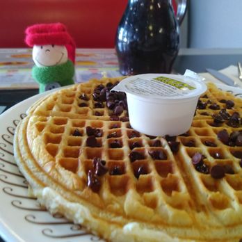 Waffle House - a waffle on a plate with a cup of yogurt - Breakfast & Brunch Near Me - Boutte, Louisiana