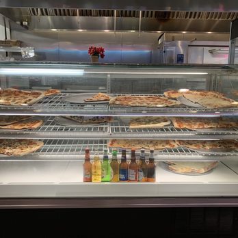 Michaelangelos Pizza & Subs - a display of pizzas - Pizza Near Me - Sneads Ferry, North Carolina