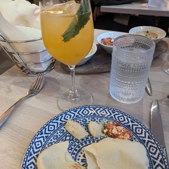 Zaytinya - Persepolis cocktail and bread with various spreads. - Greek Near Me - Washington, DC, District of Columbia