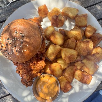 peasants FEAST - Hot chicken sandwich with a side of potatoes - American Near Me - Solvang, California