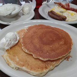 a plate of pancakes and eggs