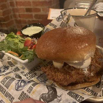 The Whiskey Coop - Popcorn chicken sandwich with side salad - American Near Me - Syracuse, New York The Whiskey Coop - Popcorn chicken sandwich with side salad - American Near Me - Syracuse, New York