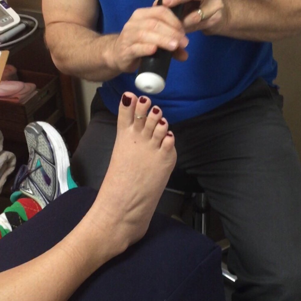 Dr. Young working on my foot. Dr. Young working on my foot.
