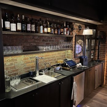 Martiny's - a kitchen with a brick wall - Cocktail Bars Near Me - New York, New York Martiny's - a kitchen with a brick wall - Cocktail Bars Near Me - New York, New York