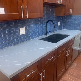 After (new quartz countertops and tile backsplash) After (new quartz countertops and tile backsplash)