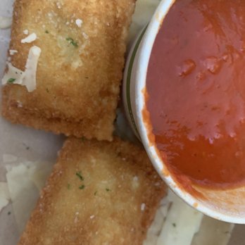 Harry & Izzy's - Fried ravioli with sauce and parmesan from the Devour menu (to go). - Steakhouses Near Me - Indianapolis, Indiana