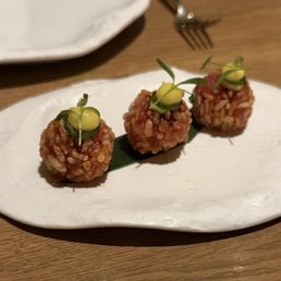 Truffle Slice, Crispy Lotus Root, Rice Puff, plum, Yuzu Chutney, and Truffle Salt.