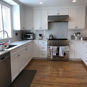 RK Construction Company - a kitchen with white cabinets and stainless steel appliances - General Contractors Near Me - Norwood, Massachusetts RK Construction Company - a kitchen with white cabinets and stainless steel appliances - General Contractors Near Me - Norwood, Massachusetts