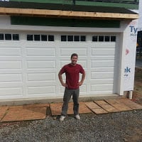 Photo of Eastern Overhead Door - Bel Air, MD, US. Charles Merryweather installing a door on new construction
