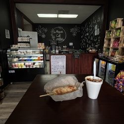 Cafe side ,with elote (street corn) and maiz in the cup called esquite