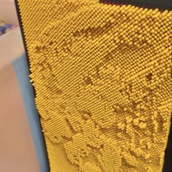 Kiddie Kingdom Playground - A fun two-sided sensory pin art board -- one side yellow, one side red. Press anything into the pins to create a raised 3D impression.