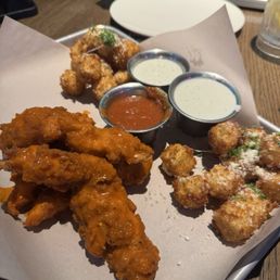 Boneless buffalo tenders and mozzarella bites. Boneless buffalo tenders and mozzarella bites.