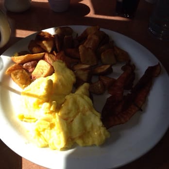 Denny's - Bacon, scrambled eggs, and red potatoes. Good food. Lighting caused bad pic, sorry. - Diners Near Me - Mount Vernon, Washington