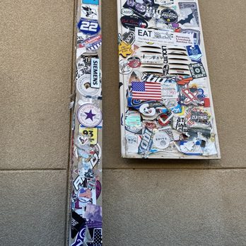 Layne's Chicken Fingers - a street sign covered in stickers - Fast Food Near Me - College Station, Texas Layne's Chicken Fingers - a street sign covered in stickers - Fast Food Near Me - College Station, Texas