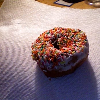 Miss Donut - a donut with sprinkles on a napkin - Donuts Near Me - Montebello, California Miss Donut - a donut with sprinkles on a napkin - Donuts Near Me - Montebello, California