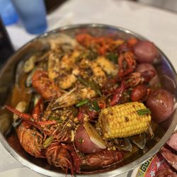 Big Pot & Grill - Everyday combo with 1 lb of shrimp, mussels and crawfish dipped in spicy Thai chili sauce. Comes with 1 corn and 1 potatoes.
