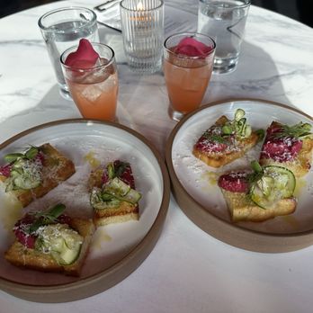 Black Iron Bystro - #2 Course toasts with a beet ricotta topping , cucumber salad, dill, pea shoots. A favorite. - Cocktail Bars Near Me - Kenmore, New York Black Iron Bystro - #2 Course toasts with a beet ricotta topping , cucumber salad, dill, pea shoots. A favorite. - Cocktail Bars Near Me - Kenmore, New York