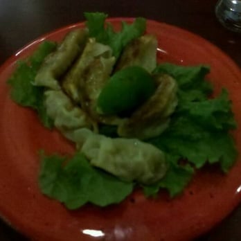 Kotobuki - dimly lit Gyoza. that green "football" in the middle is a lime wedge - Japanese Near Me - Oakland, California