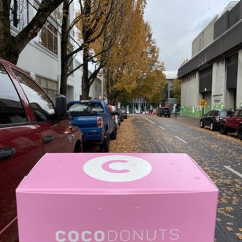 Coco Donuts - Uptown - The pink box against the fall landscape - Donuts Near Me - Portland, Oregon