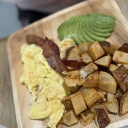 Cafe Wild - Eggs Your Way, with potatoes and bacon with a side of avocado