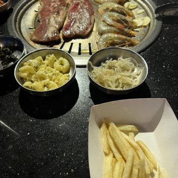 Hot Stone Korean Kitchen - Cooking shrimp and brisket with a side of fries - Korean Near Me - Fairfield, California