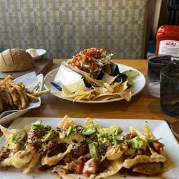 Poke Nachos* fish tacos Lobster Roll*** Poke Nachos* fish tacos Lobster Roll***