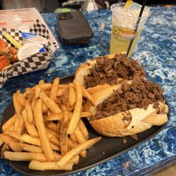 Paradise Pub - Cheesesteak and fries delicious