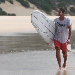 Classic Malibu - Surfer Ben Haworth up at Double Island Point with his Noserider Log.
