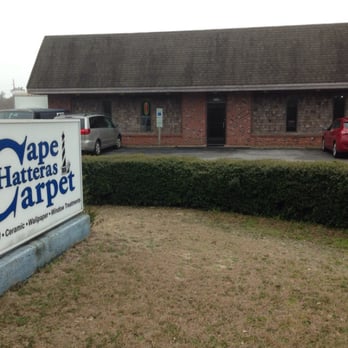 Cape Hatteras Carpet - a sign in front of a building - Carpet Installation Near Me - Buxton, North Carolina