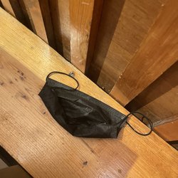 I face mask that someone left from the night before seeing we were the first customers to get that table.