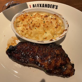 J. Alexander's - New York strip w Mac & Cheese yummm - New American Near Me - Madison, Alabama