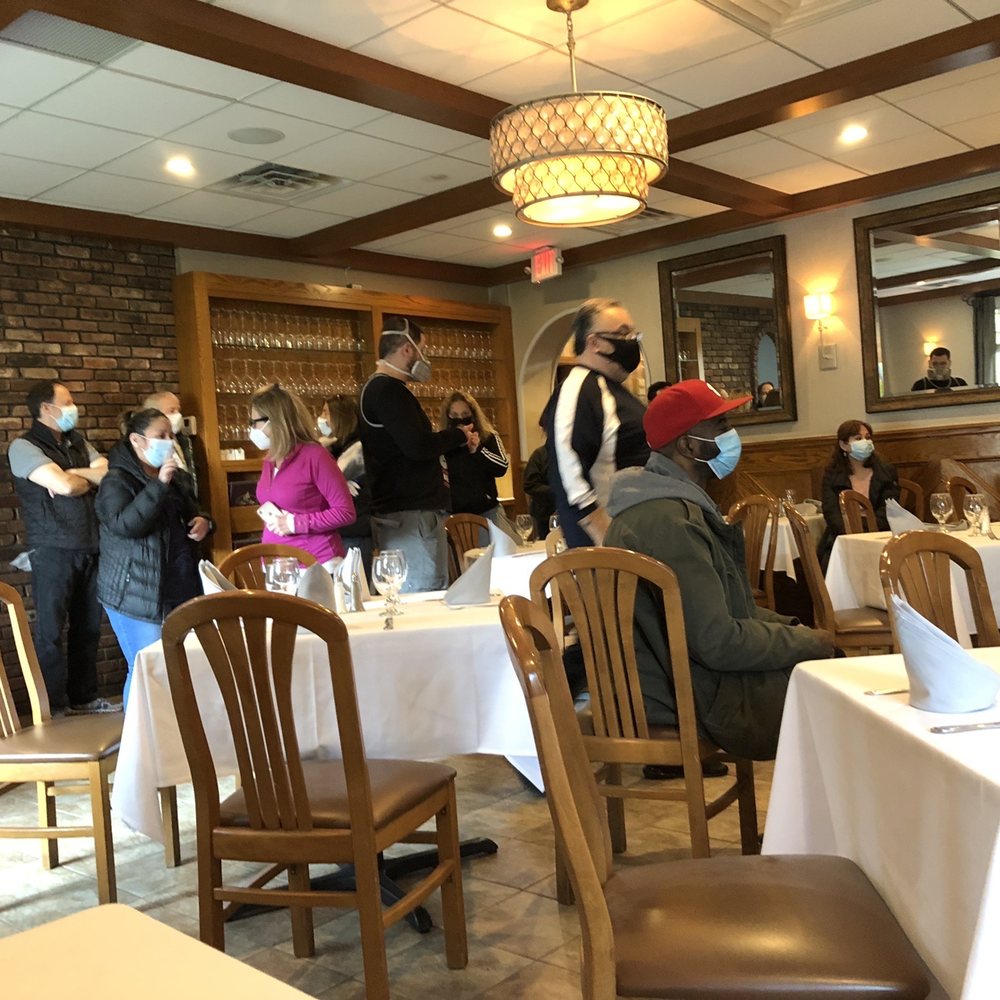 Don Pepe - a group of people in a restaurant - Spanish Near Me - Newark, New Jersey Don Pepe - a group of people in a restaurant - Spanish Near Me - Newark, New Jersey